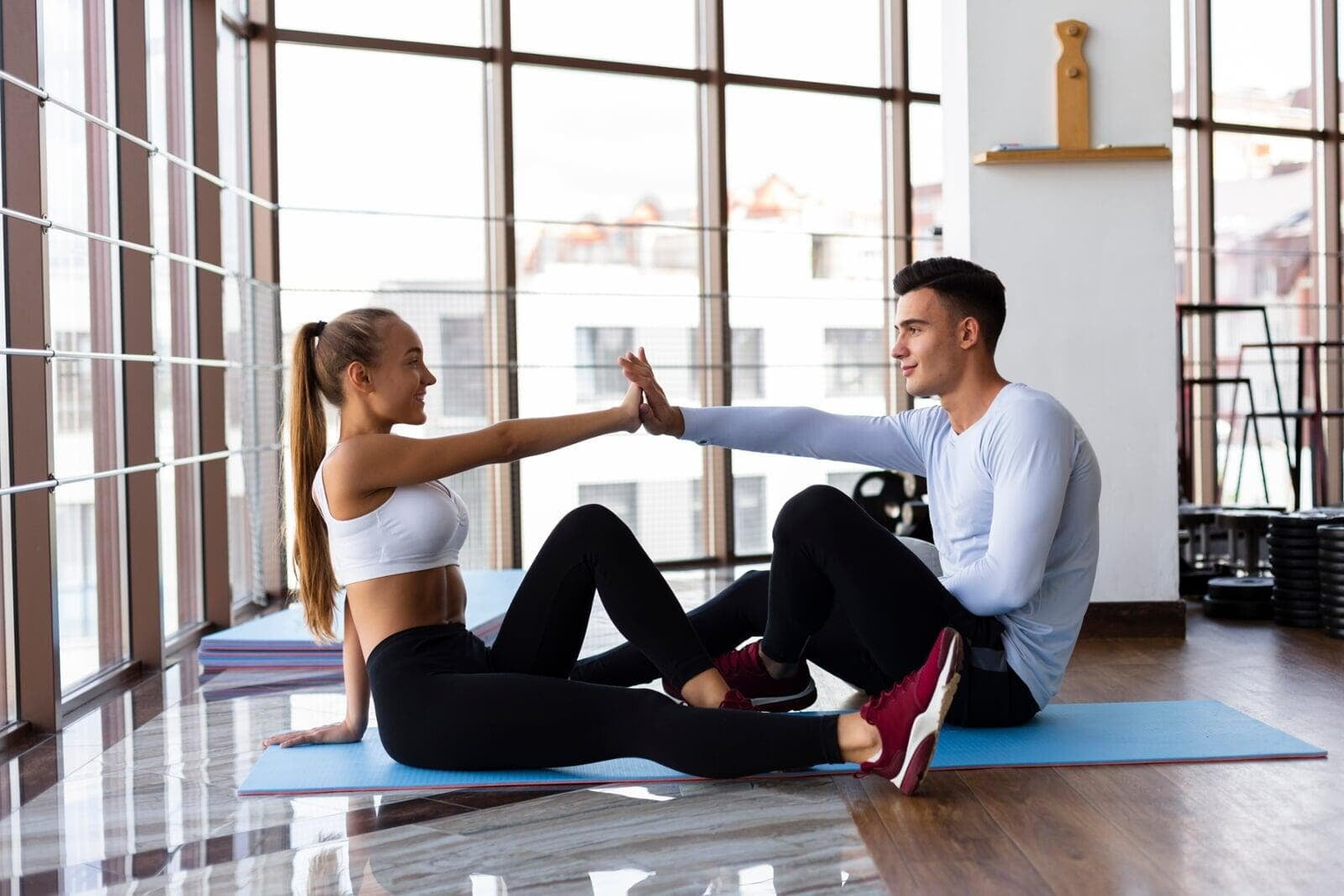 Couple practising a gentle stretch together at home